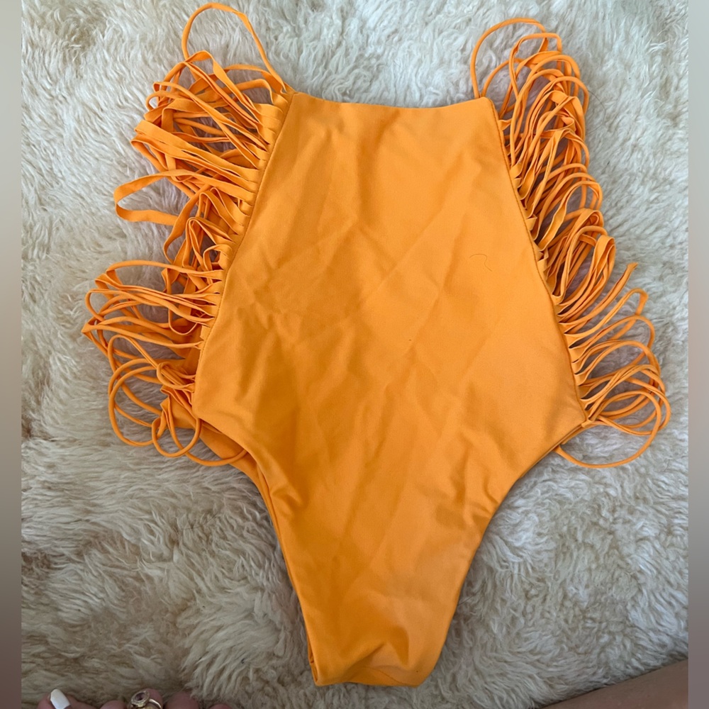 Handmade by a designer, high waisted swim bottoms with string sides.